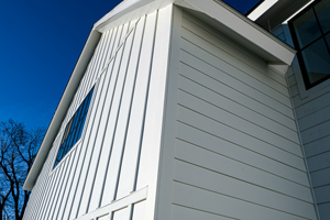 Modern farmhouse with James Hardie fiber cement siding - Legit Exteriors, serving Portland OR & Vancouver WA explains the cost to replace siding. 